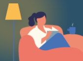 Person sat on the sofa reading 