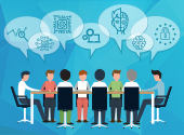 people sat around at a table in a meeting