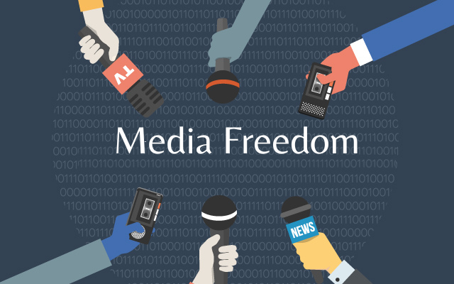 six arms holding microphones to represent media freedom